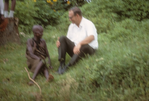 Two people chatting on a hillside