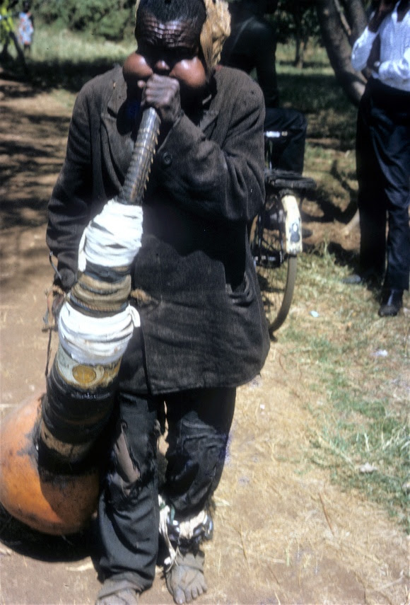 Man playing a homemade tuba