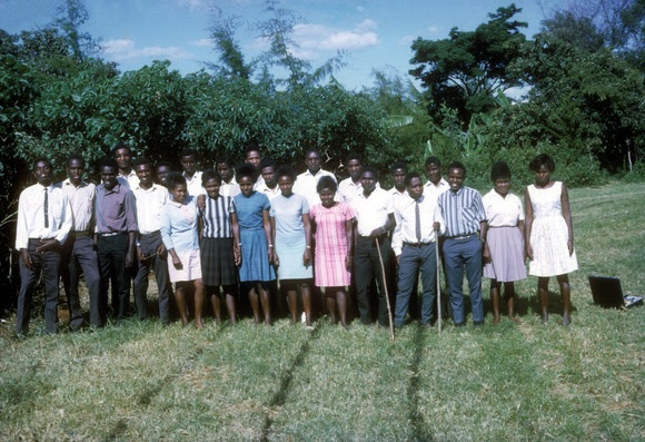 Students posing in a field