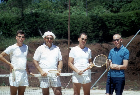 Four men on a tennis court