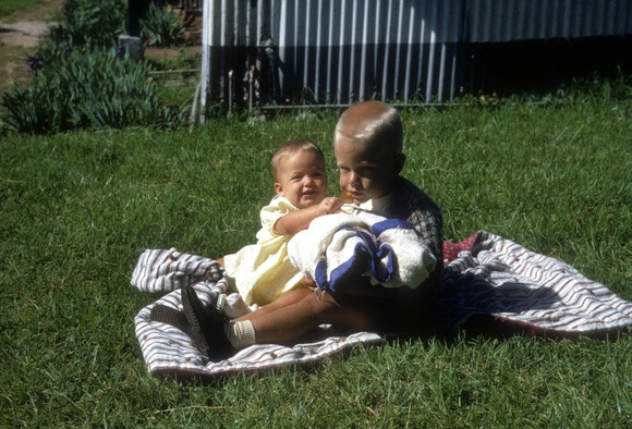 Two children on a blanket